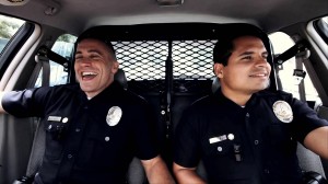 Jake Gyllenhaal and Michael Peña star in David Ayer's "End of Watch," which tied "House at the End of the Street" for the top slot at the box office this weekend.