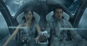 Olga Kurylenko and Tom Cruise star in the sci-fi blockbuster "Oblivion," here reviewed by James Frazier.