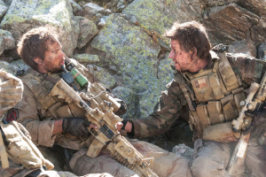 Taylor Kitsch and Mark Wahlberg star in Peter Berg's "Lone Survivor," here reviewed by film critic James Frazier.